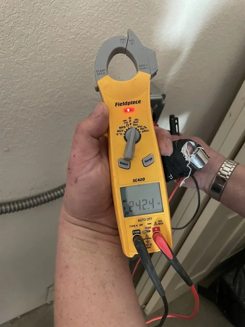 Voltage testing with clamp meter during Electrical Installation Services in Sandy